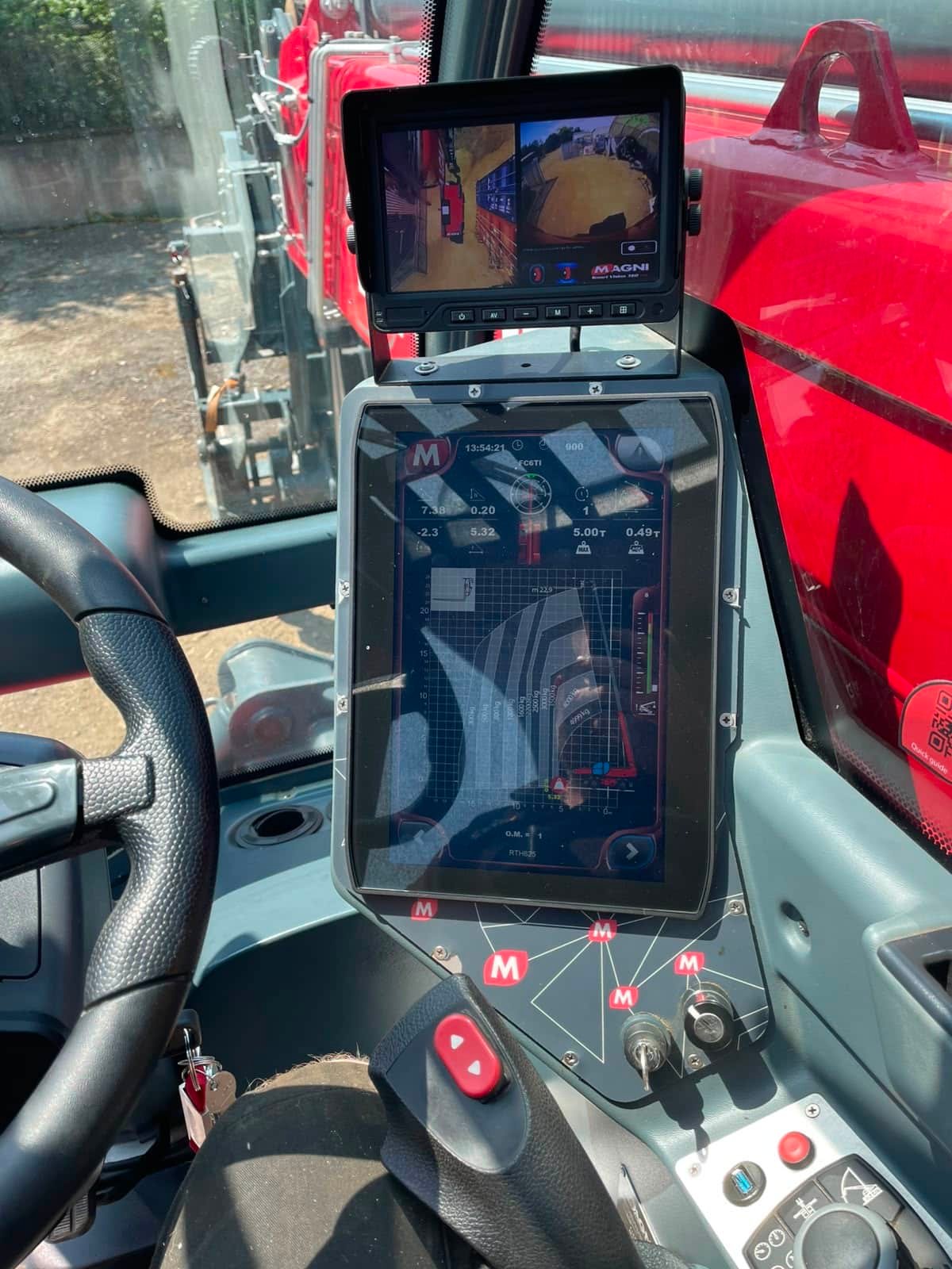Telehandler cab interior with digital control displays