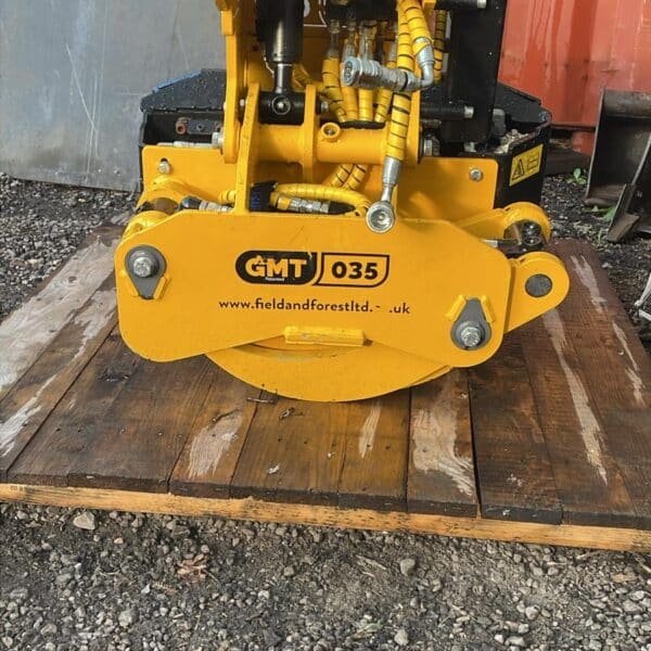 Yellow GMT 035 hydraulic tree stump grinder attachment