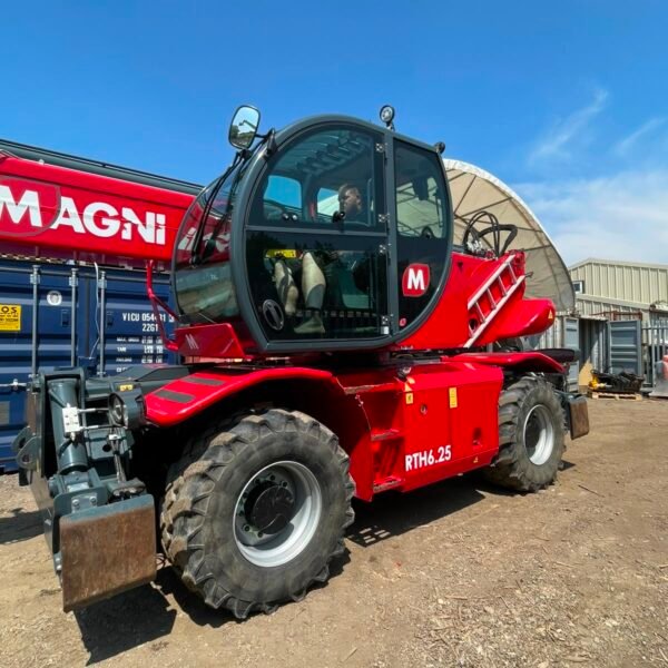 Red Magni rotating telehandler at construction yard
