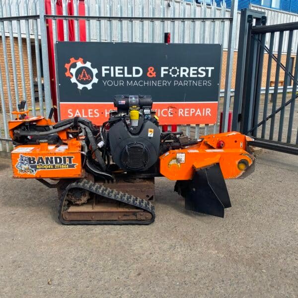 Orange Bandit stump grinder on tracks outdoors
