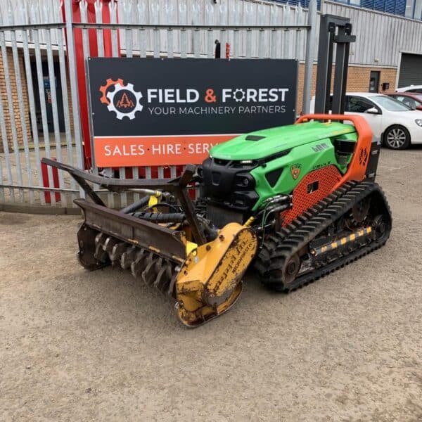 Tracked forestry mulcher outside machinery depot