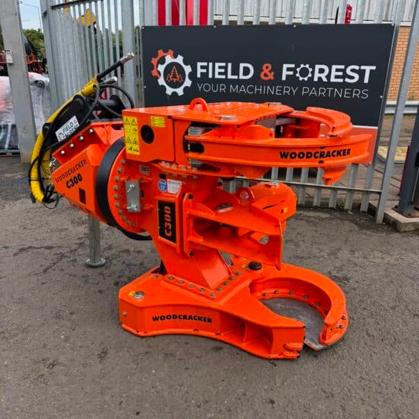 Woodcracker C300 forestry attachment in industrial yard