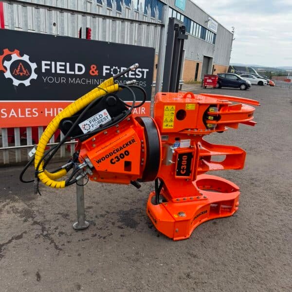 Orange Woodcracker C300 tree shear attachment outdoors