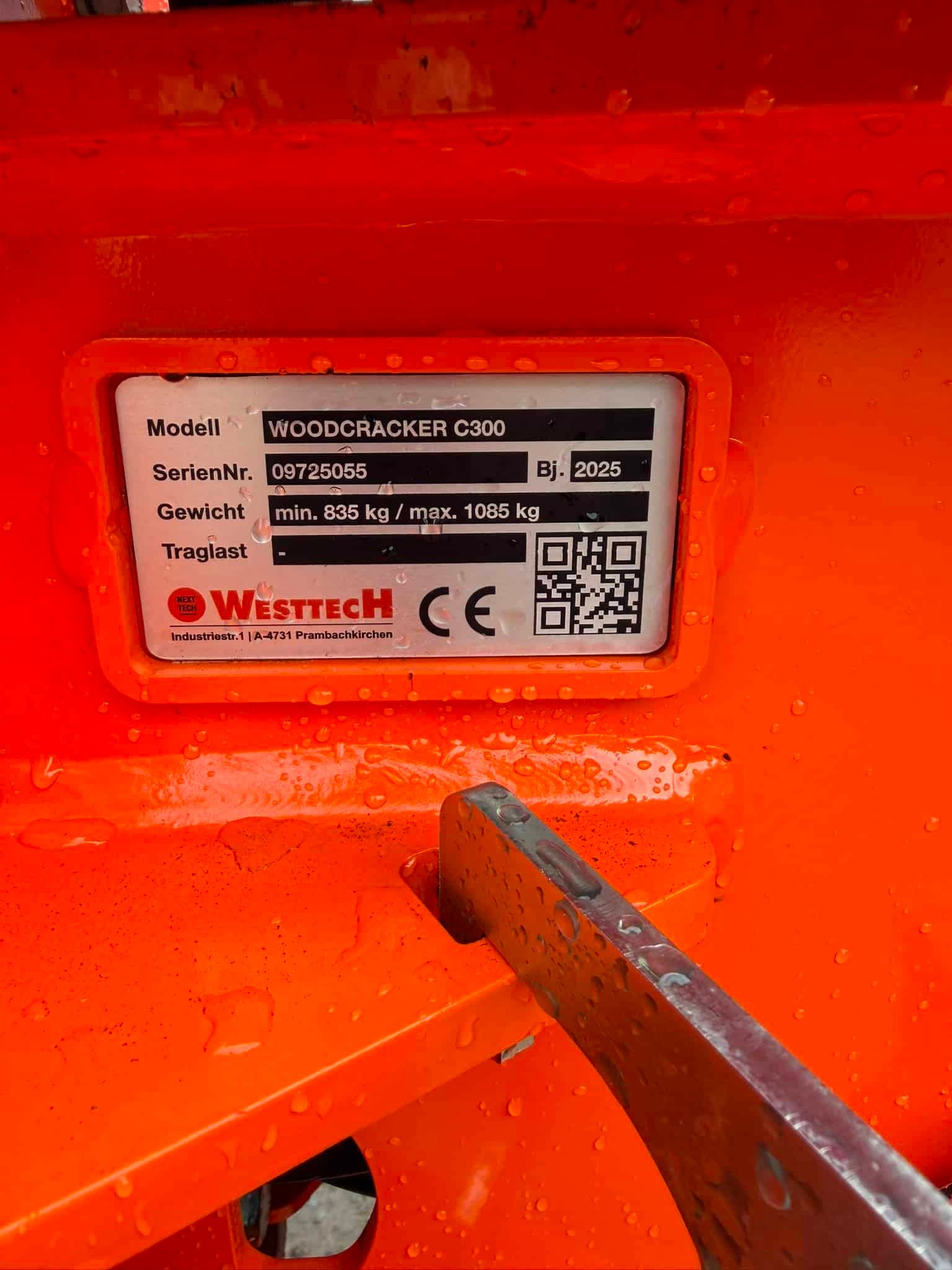 Identification plate on orange Woodcracker C300 machine