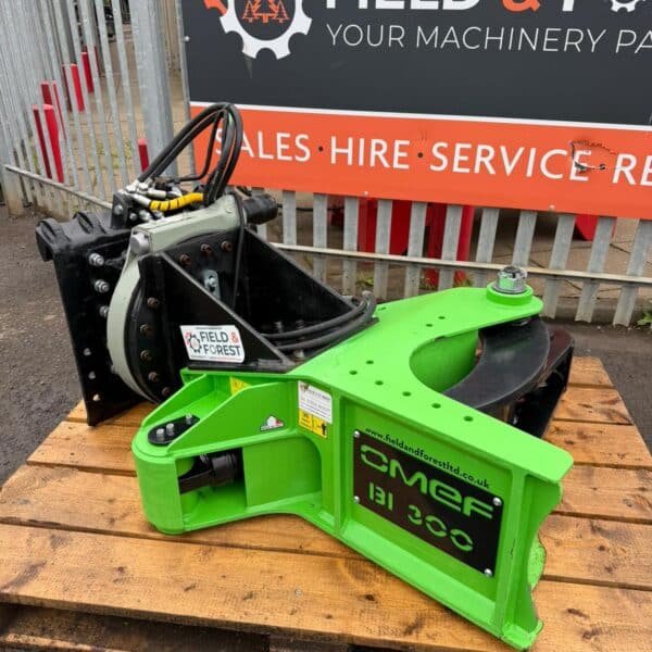 Green CMF BI300 forestry attachment on pallet
