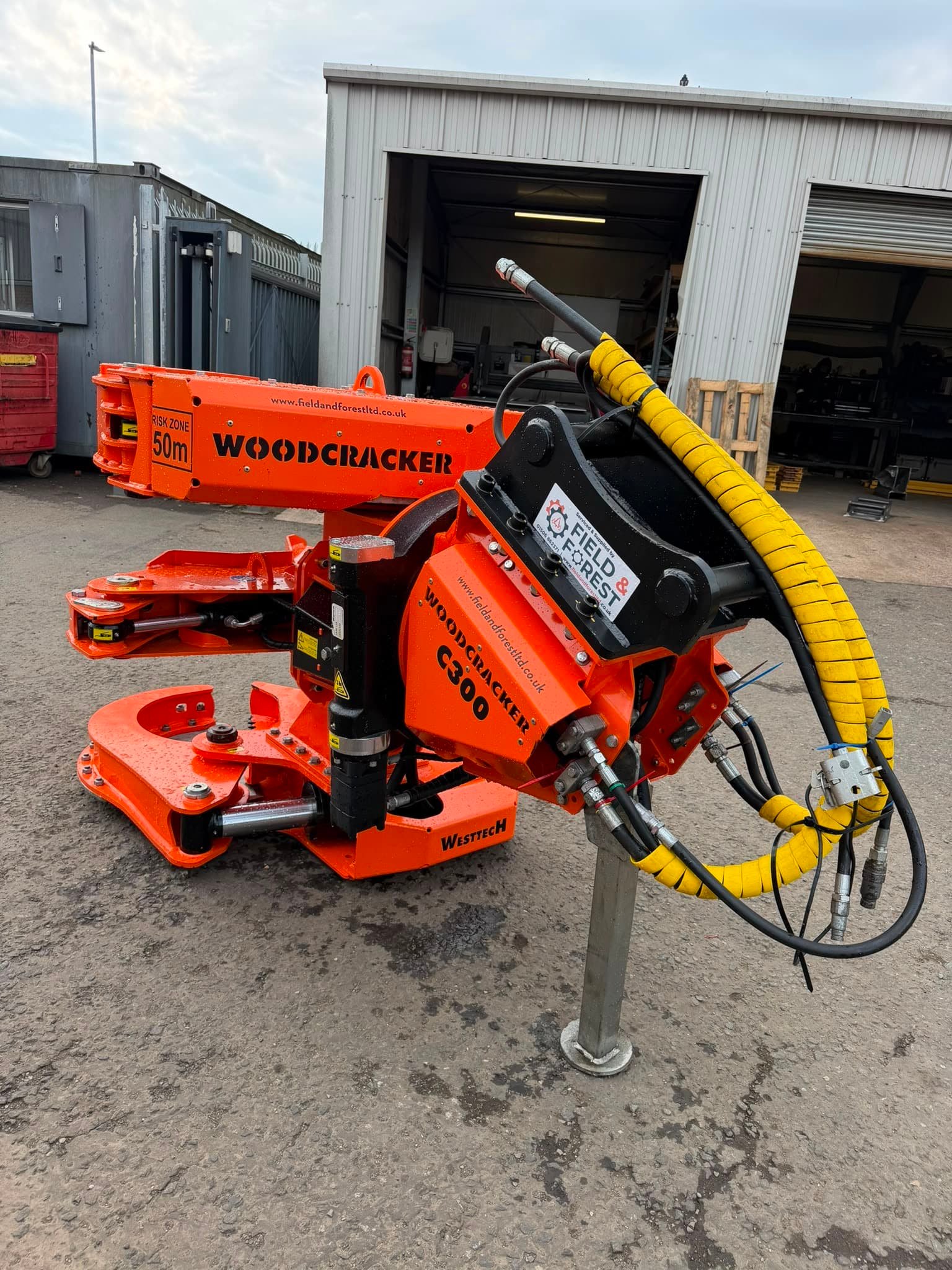 Woodcracker C300 forestry attachment outside workshop
