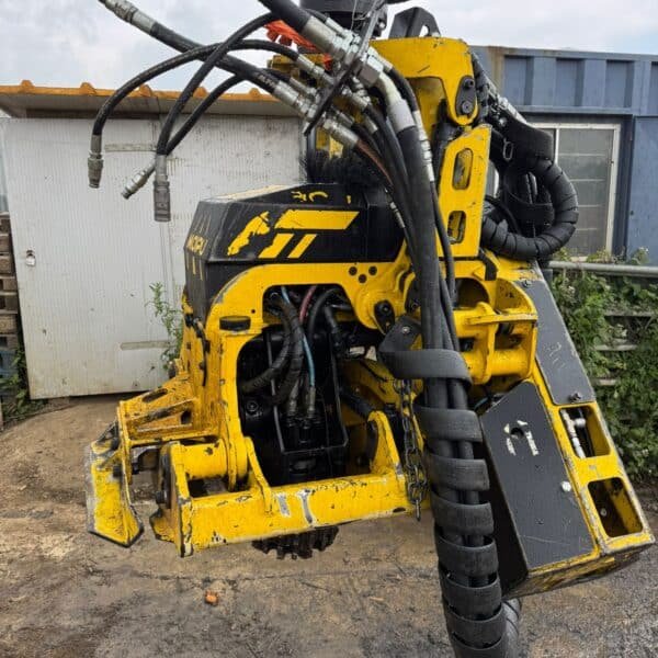 Yellow hydraulic drilling attachment with hoses