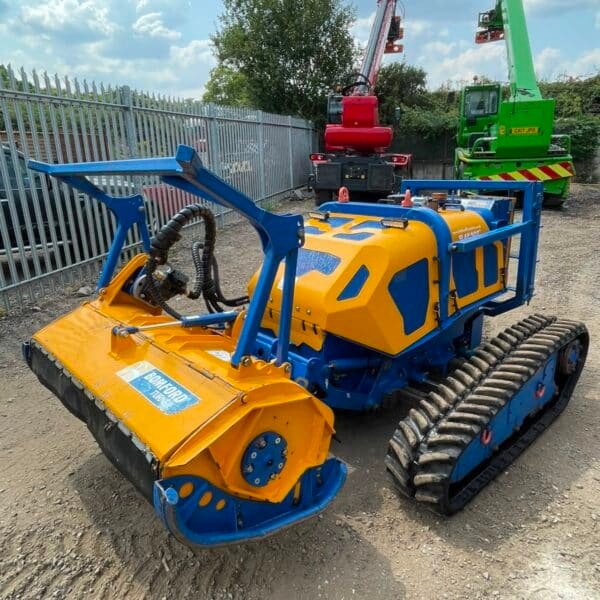 Tracked flail mower in construction yard