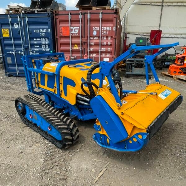 Blue and yellow tracked forestry mulcher machine