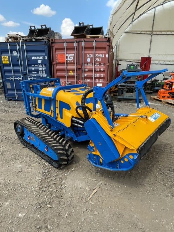 Blue and yellow tracked forestry mulcher machine