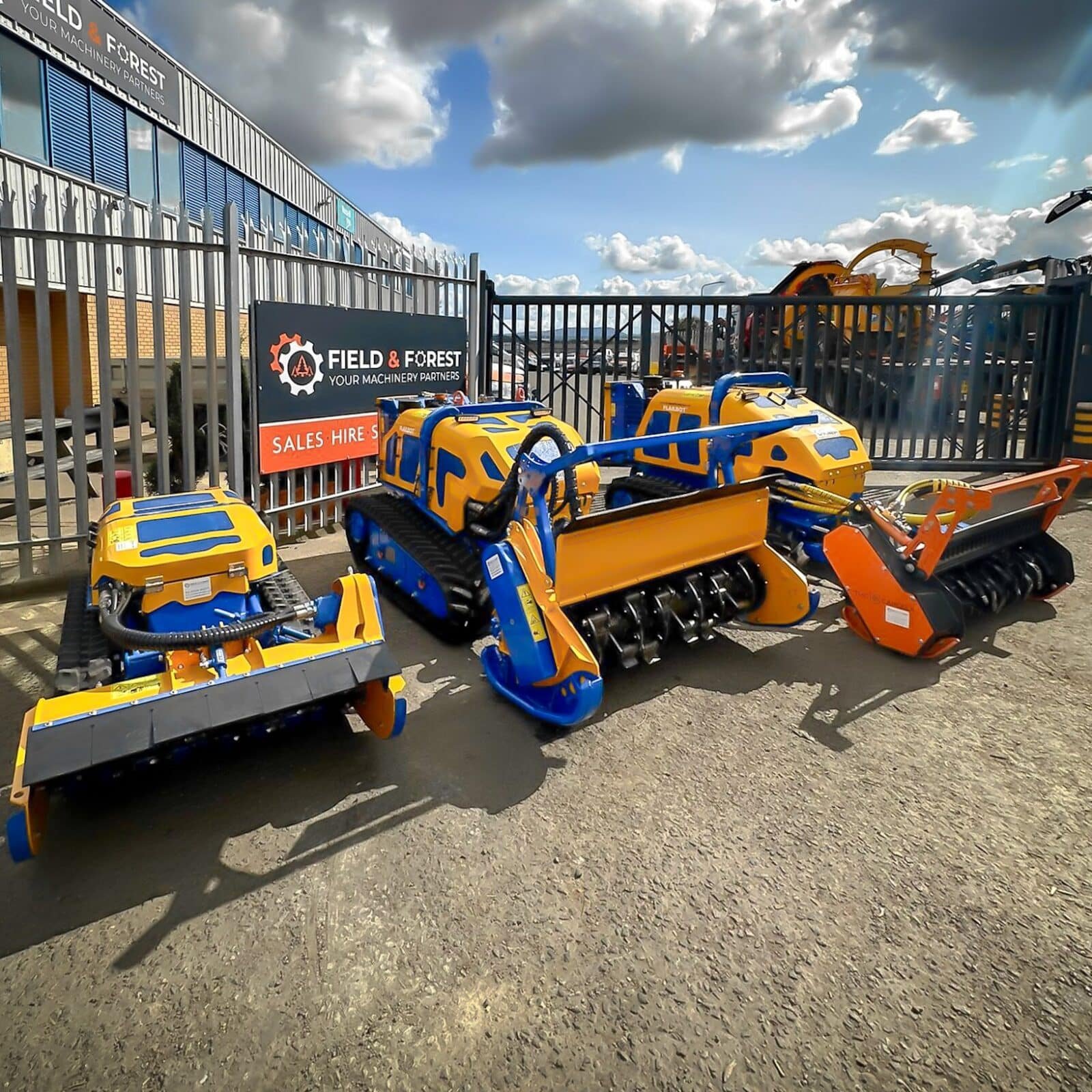 Tracked forestry mulchers outside machinery dealership yard